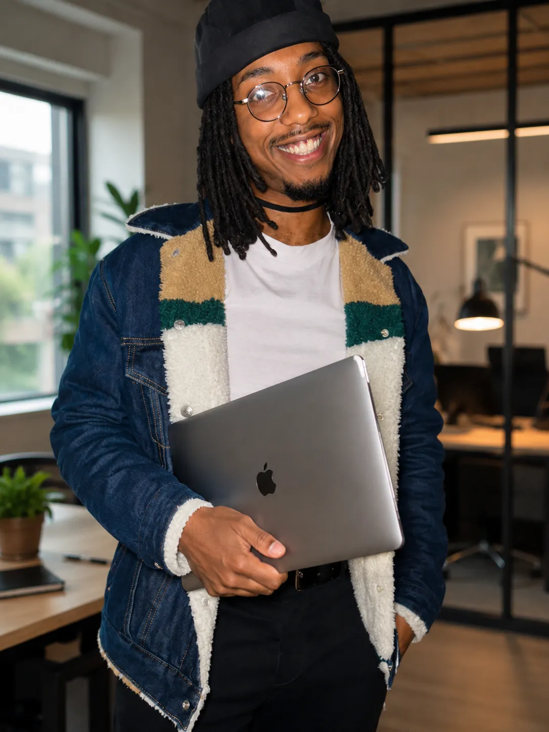 Ricardo working at a desk with a Mac